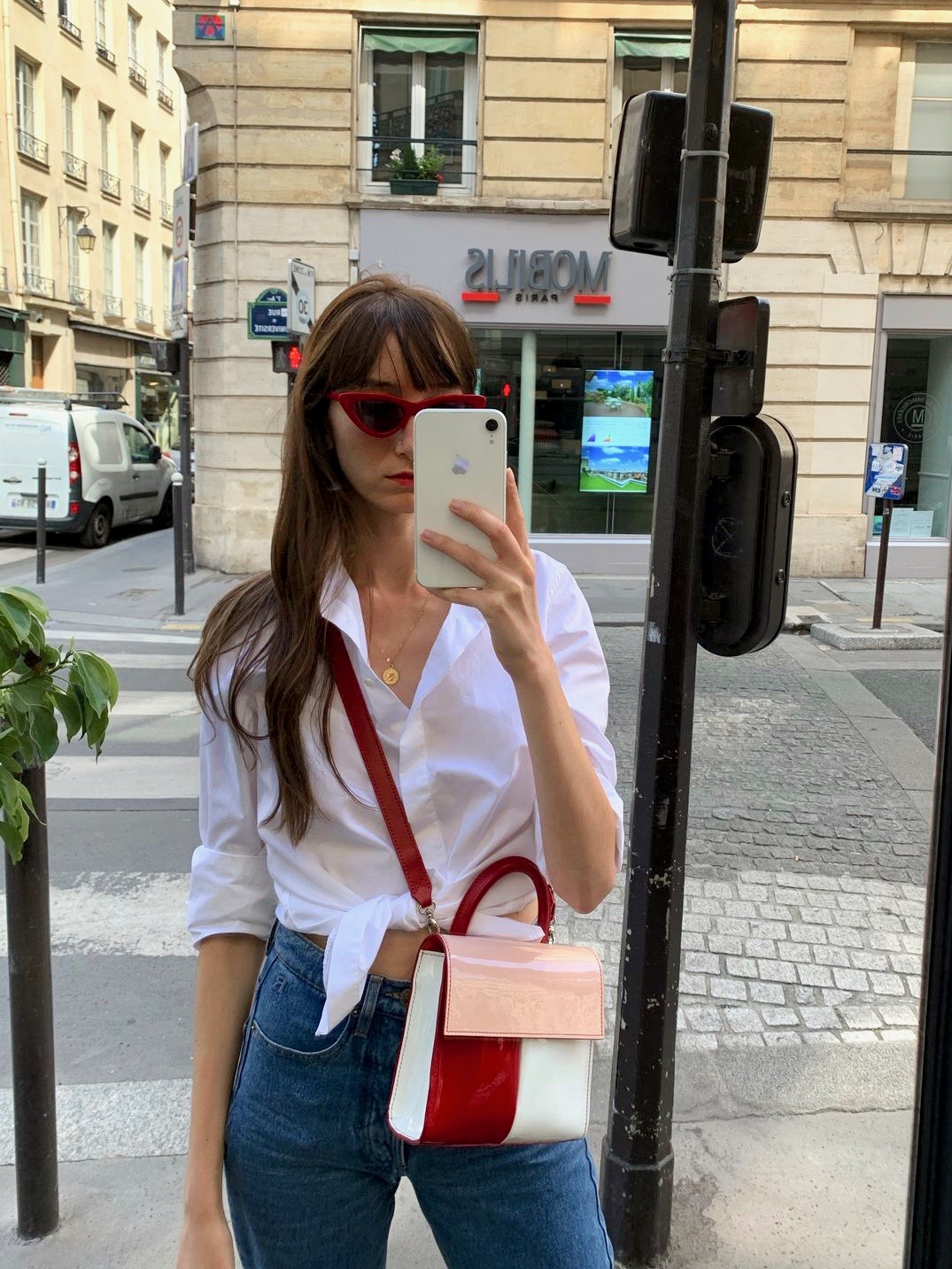 French Brands to Know if You Love French Style - by Victoria Petersen - wearing a Figaret button-up shirt, Carel handbag, Rouje jeans, and Rendel sunglasses